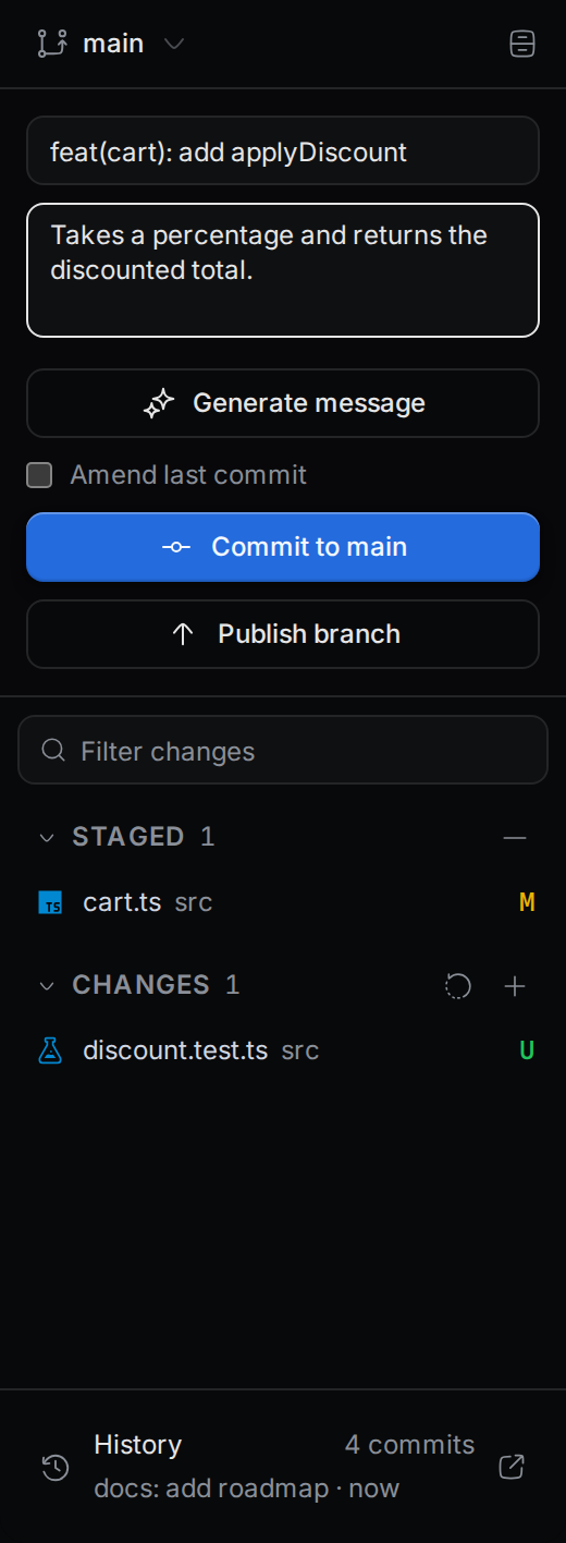 The commit box with a summary filled in, a staged file, and the Commit to main button